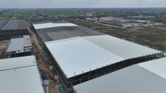 H ビーム鋼構造の建物、カスタマイズ可能なクリアスパン スペース、加工工場の保管倉庫および生産ワークショップに使用される取り外し可能なコンポーネント